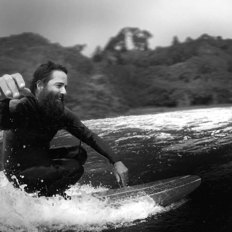 California artist Matt Beard all smiles while surfing near his home in Northern California
