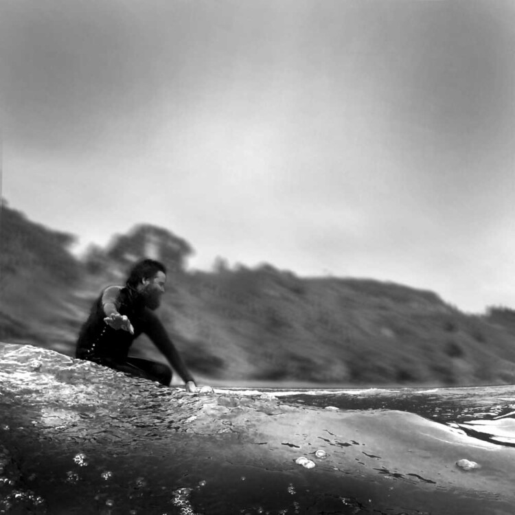 Artist Matt Beard enjoying the glide while surfing in California