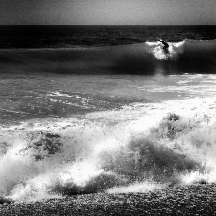 Artist Matt Beard surfs a fun beachbreak on the coast of Northern California