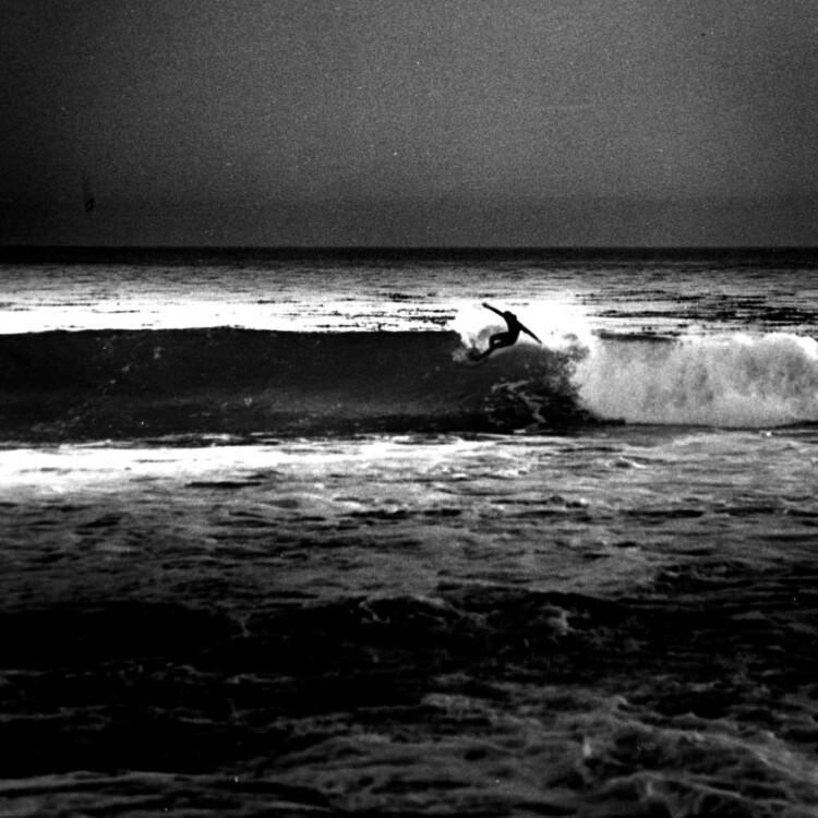 California artist Matt Beard surfing near Santa Cruz, California